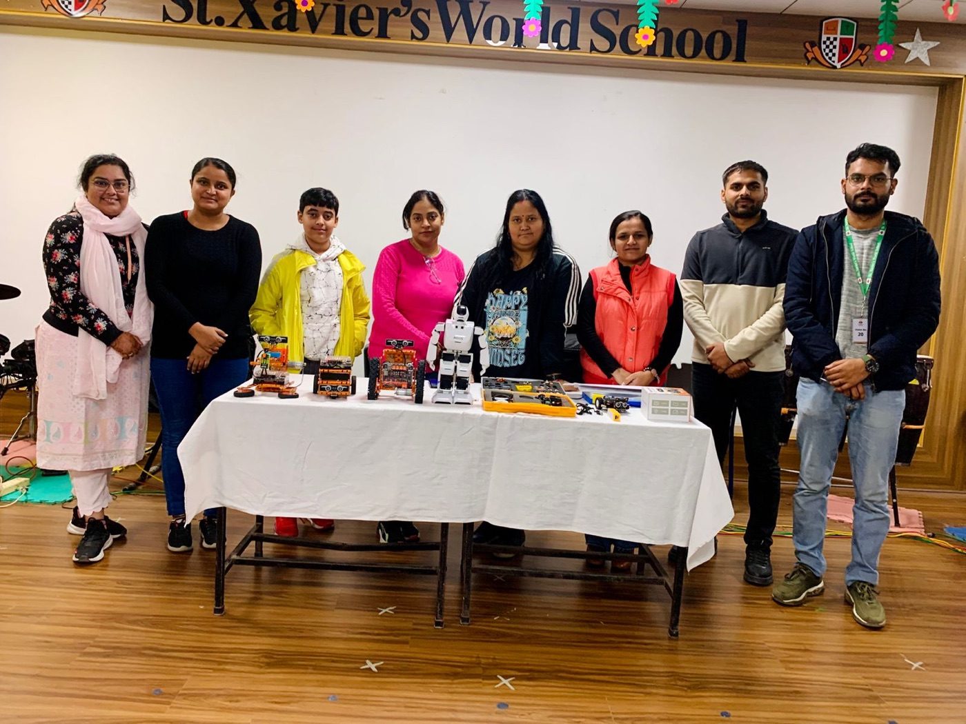 Robosix team with a school