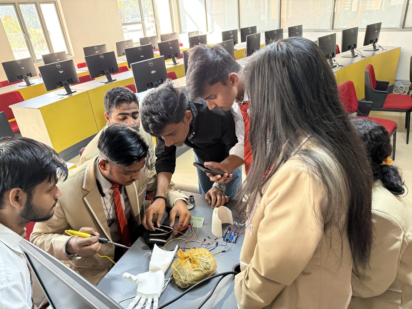 Students collaborating on a build