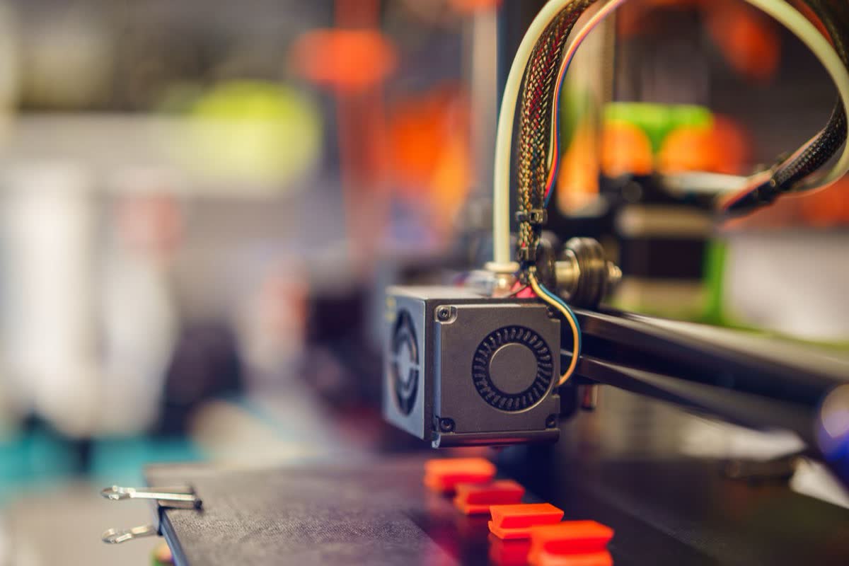 A 3D printer extruding filament